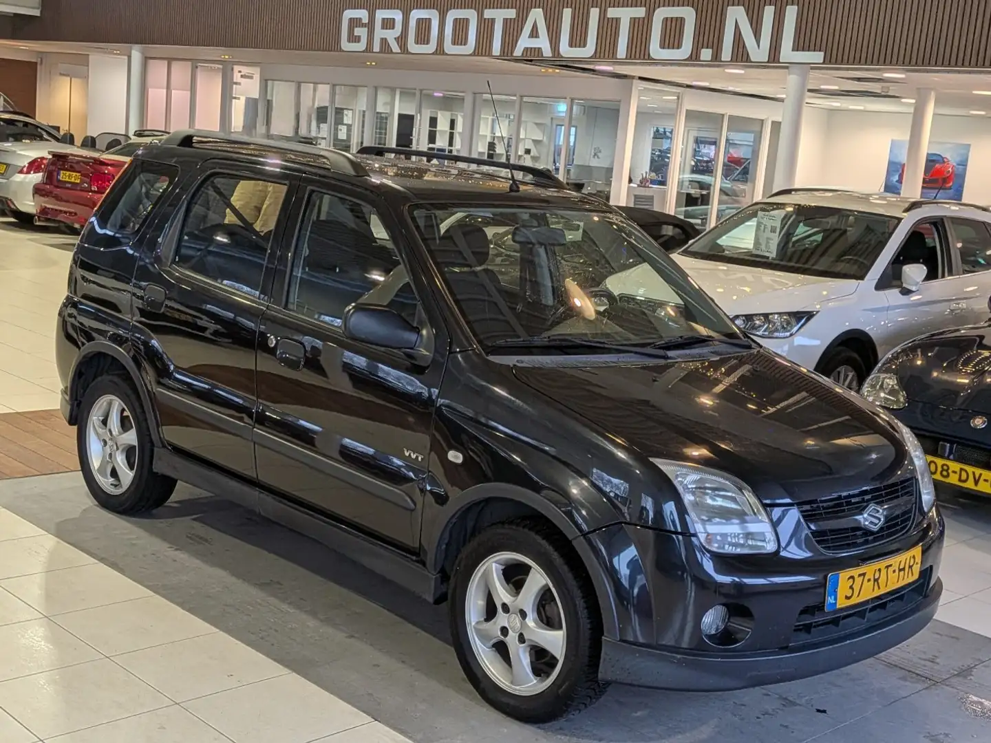 Suzuki Ignis 1.3-16V FreeStyle Airco, Stuurbekrachtiging Schwarz - 1
