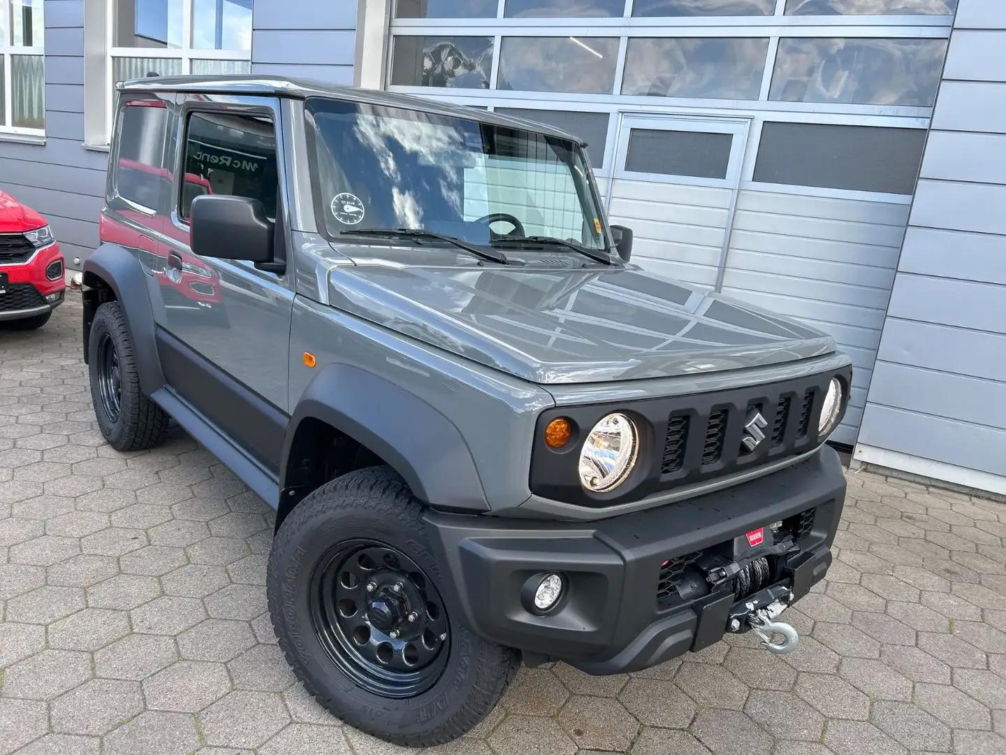 Suzuki Jimny Comfort AllGrip+Winde+AHK+Airlocker ARB Grau - 1