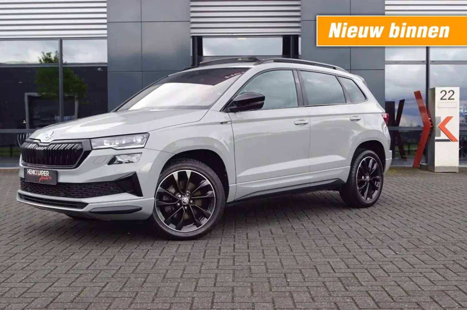 Skoda Karoq 1.5 TSI DSG Sportline/ Panodak/ Standverwarming/ C Grijs - 1