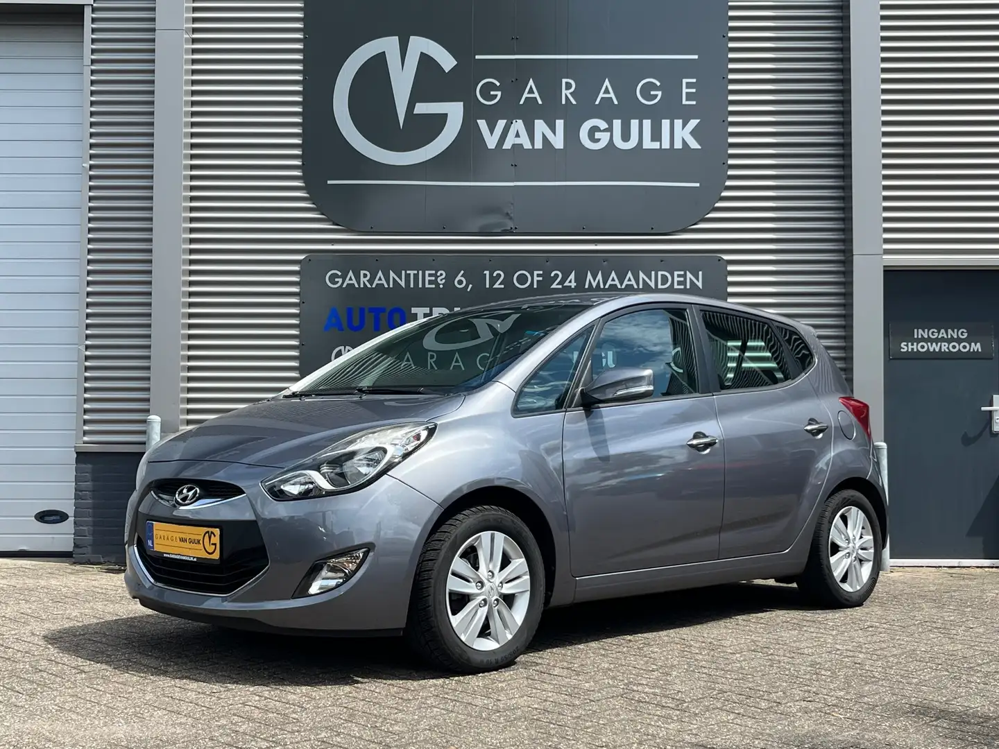 Hyundai iX20 1.4i i-Drive 90PK Trekhaak,Clima,Cruise,Isofix,Lmv Grau - 1