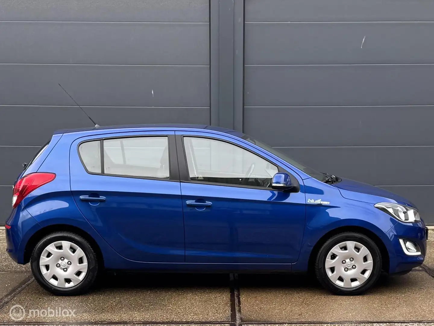 Hyundai i20 1.2i i-Motion 5 deurs - AIRCO - PDC - EL. RAMEN + Blauw - 2