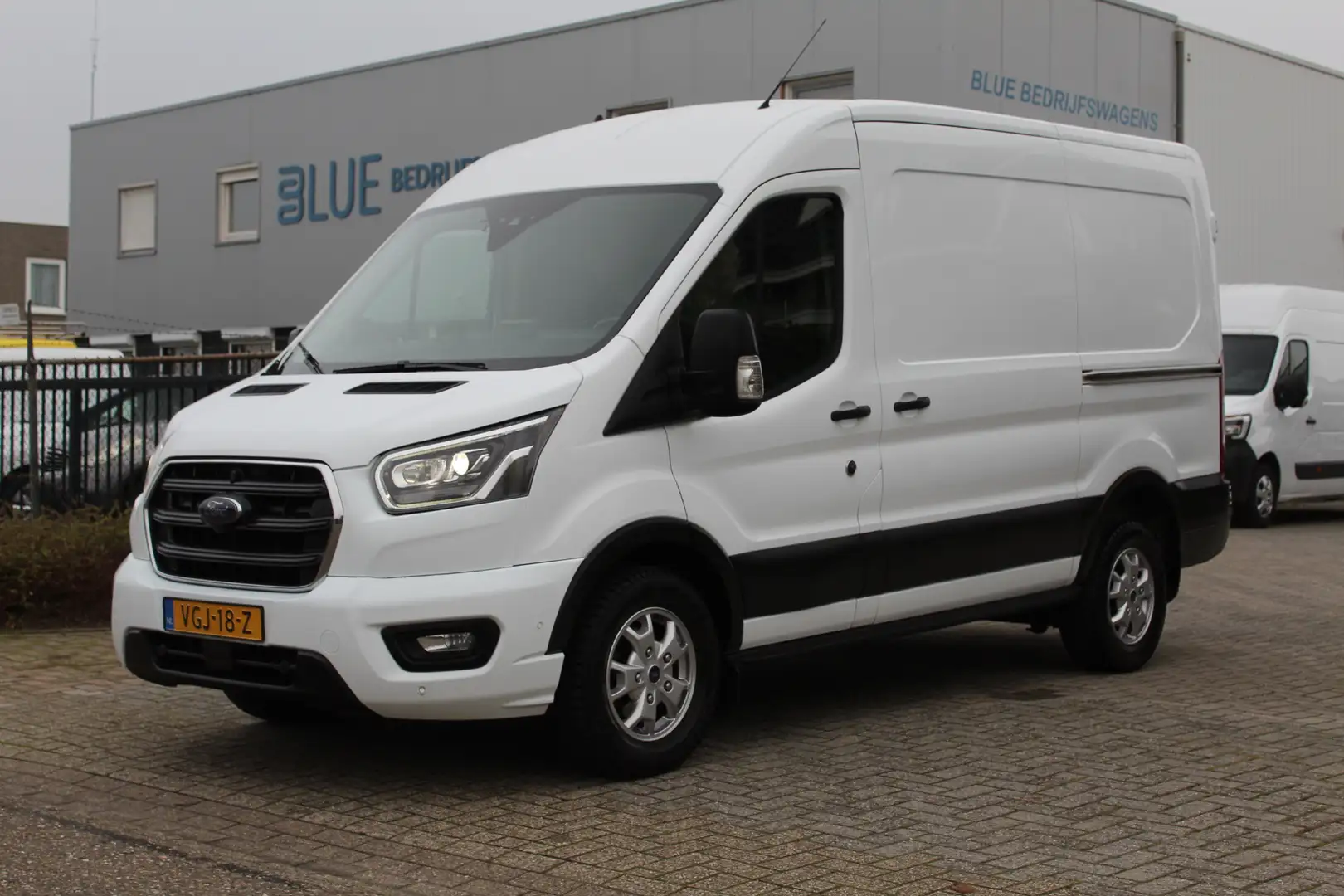 Ford Transit 350 2.0 TDCI 185PK E6 Automaat L2H2 Limited ✓ 3-zi Wit - 1