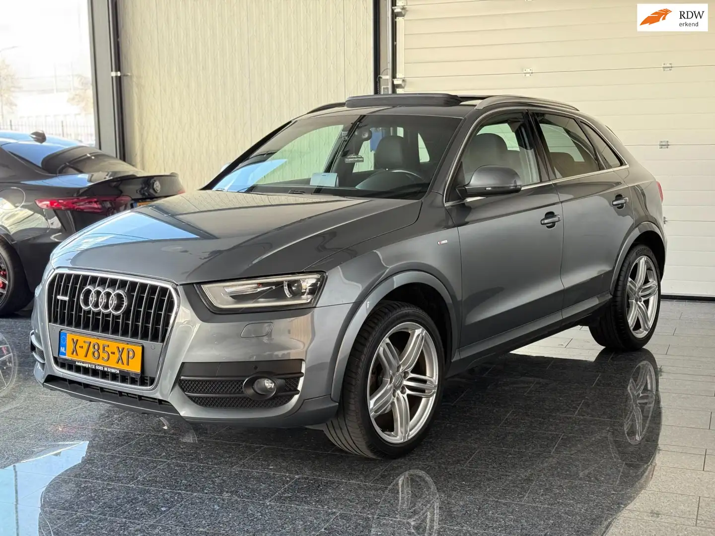 Audi Q3 2.0 TFSI Quattro Pro Line 211PK S-line S-tronic pa Grijs - 1