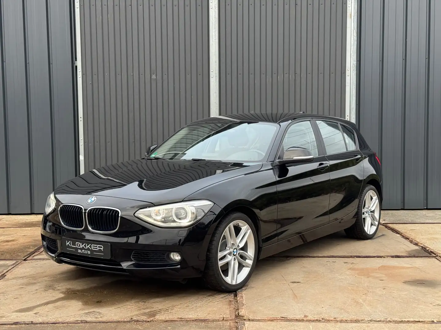 BMW 118 1-serie 118i High Executive Xenon | Navigatie | Cl Schwarz - 1