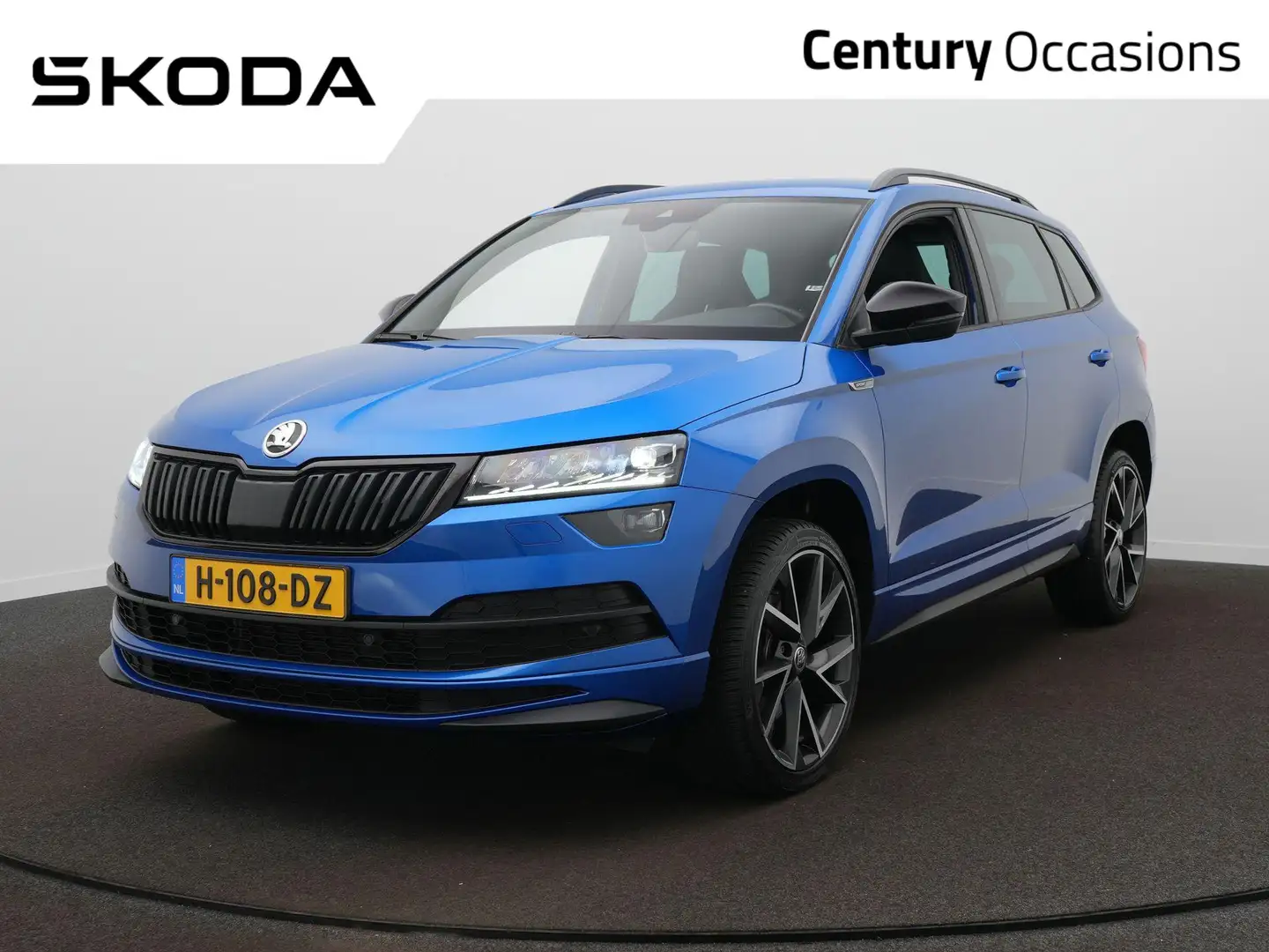 Skoda Karoq 1.5 TSI ACT Sportline Business / Elektr. Trekhaak Blauw - 1