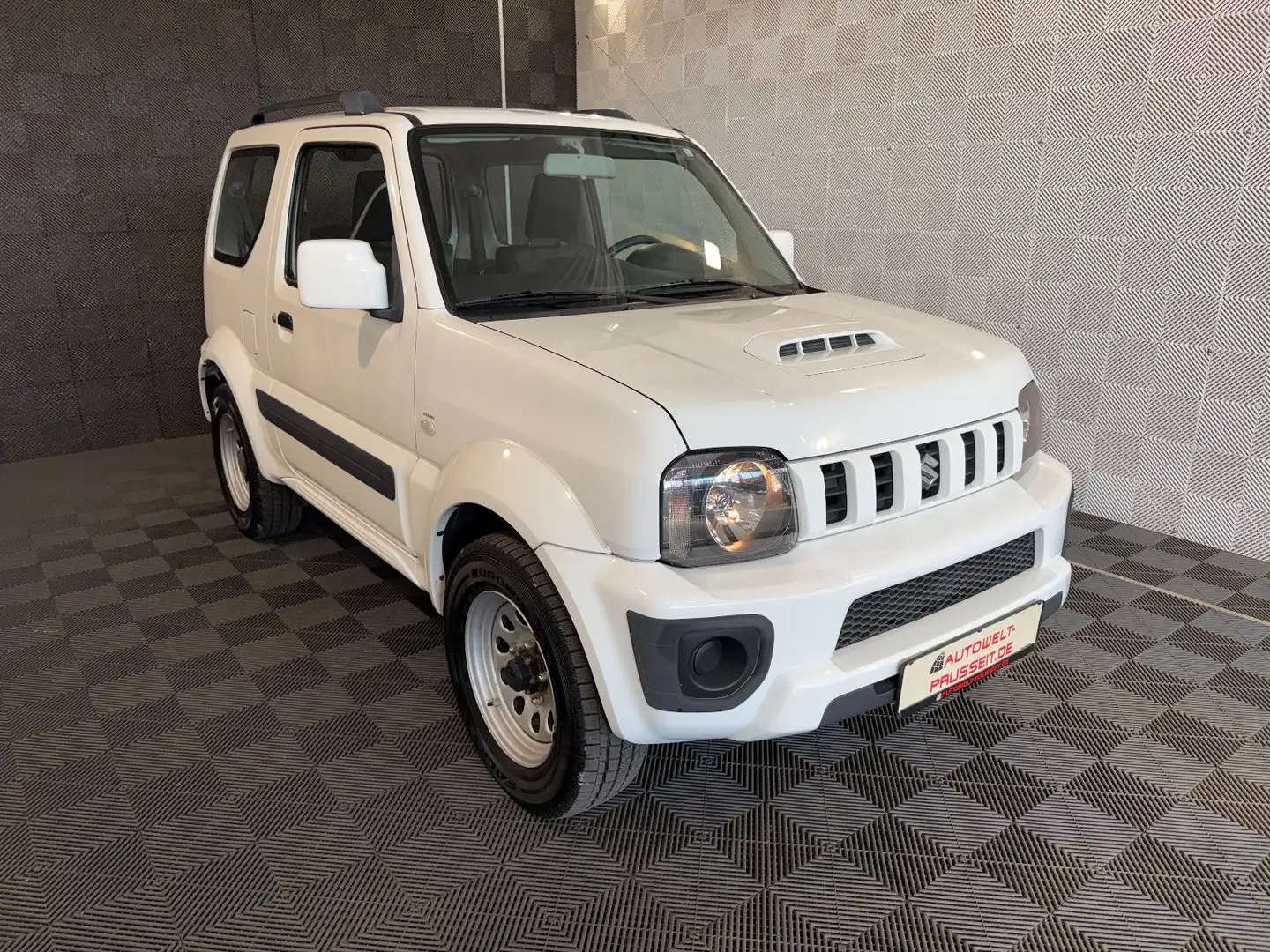 Suzuki Jimny 1.3 Comfort Ranger*ALLGRIP*AHK-SHZ-KLIMA Weiß - 1
