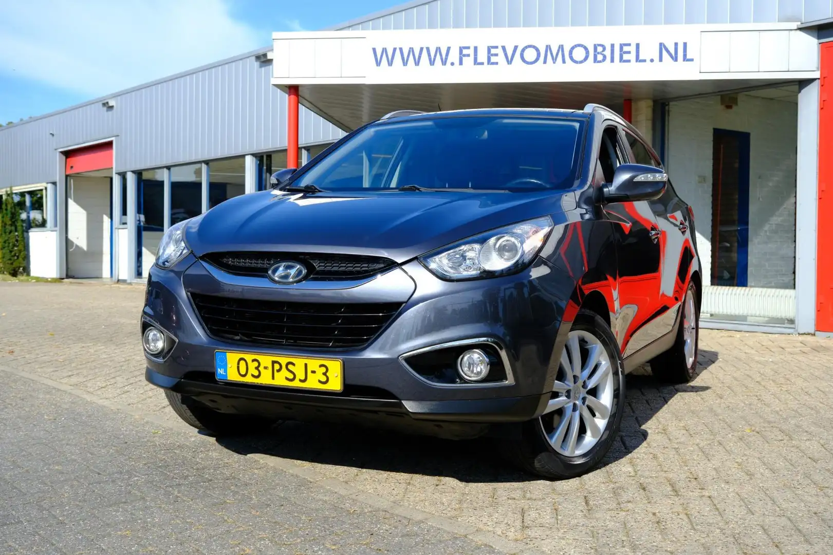 Hyundai iX35 2.0i 163pk i-Catcher Pano|Leder|Navi|Clima|LMV Grijs - 1