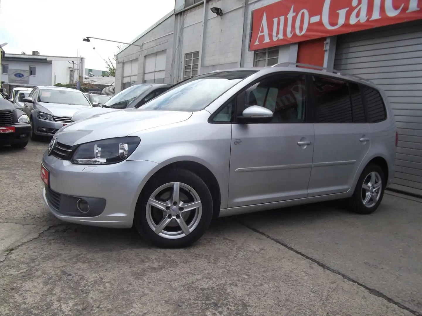 Volkswagen Touran 1,4i Highline Autom, Navigation Plateado - 1