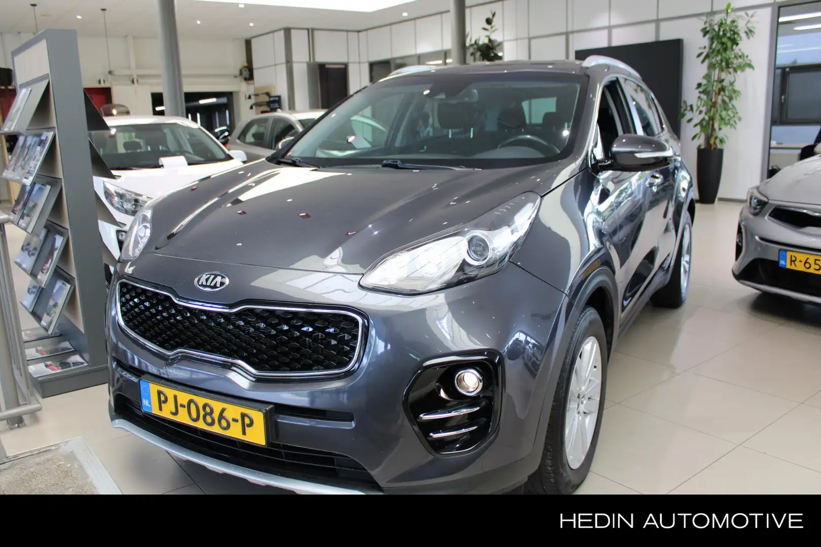 Kia Sportage 1.6 T-GDI 4WD DynamicLine l Automaat l Navigatie l Grijs - 1