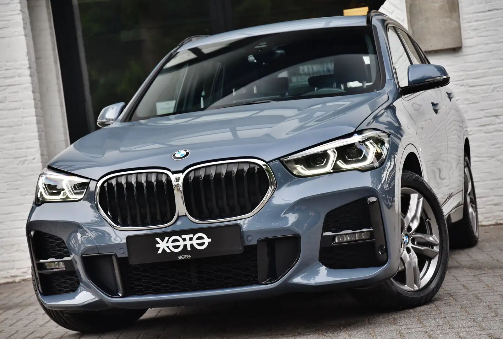 BMW X1 18i AUT. M SPORT *** 1HD. / VAT REFUNDABLE *** Grijs - 1