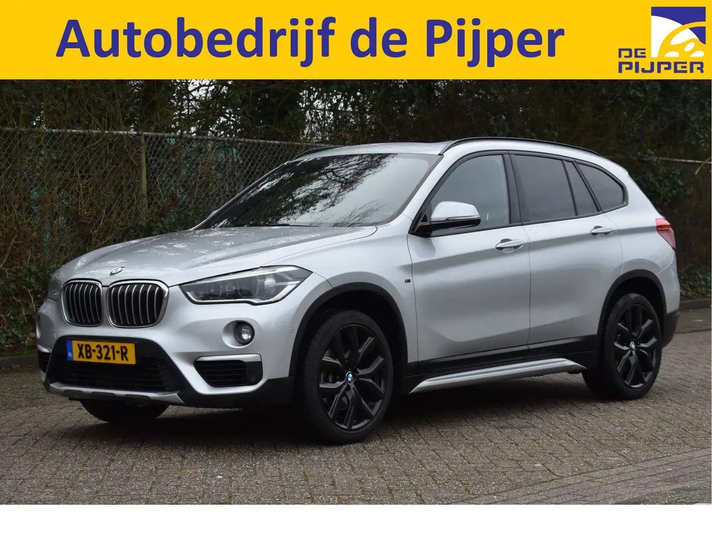 BMW X1 sDrive20i Orange Edition II Open dak |  Cruise con Grijs - 1