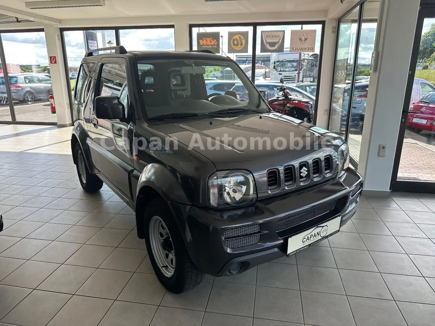 Suzuki Jimny Club Lim. 4x4 Klima/Scheckheft/Allwetter Grau - 1
