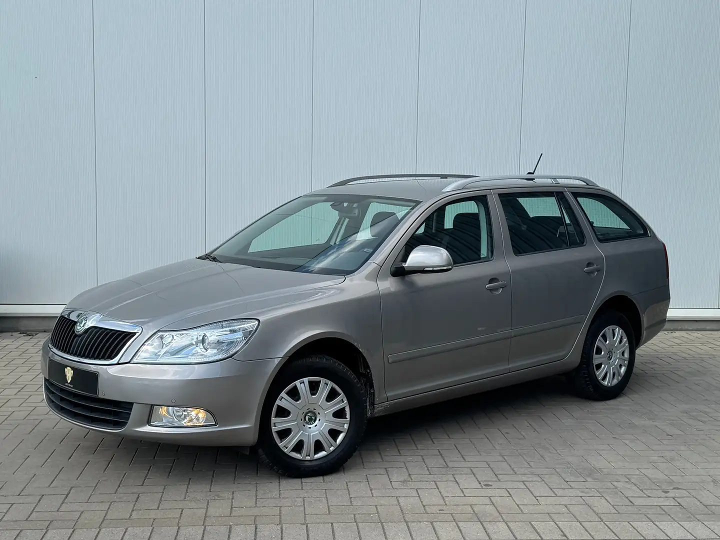 Skoda Octavia ✅1.6 TDI GARANTIE Airco Navi Trekhaak Parksensor Grijs - 1