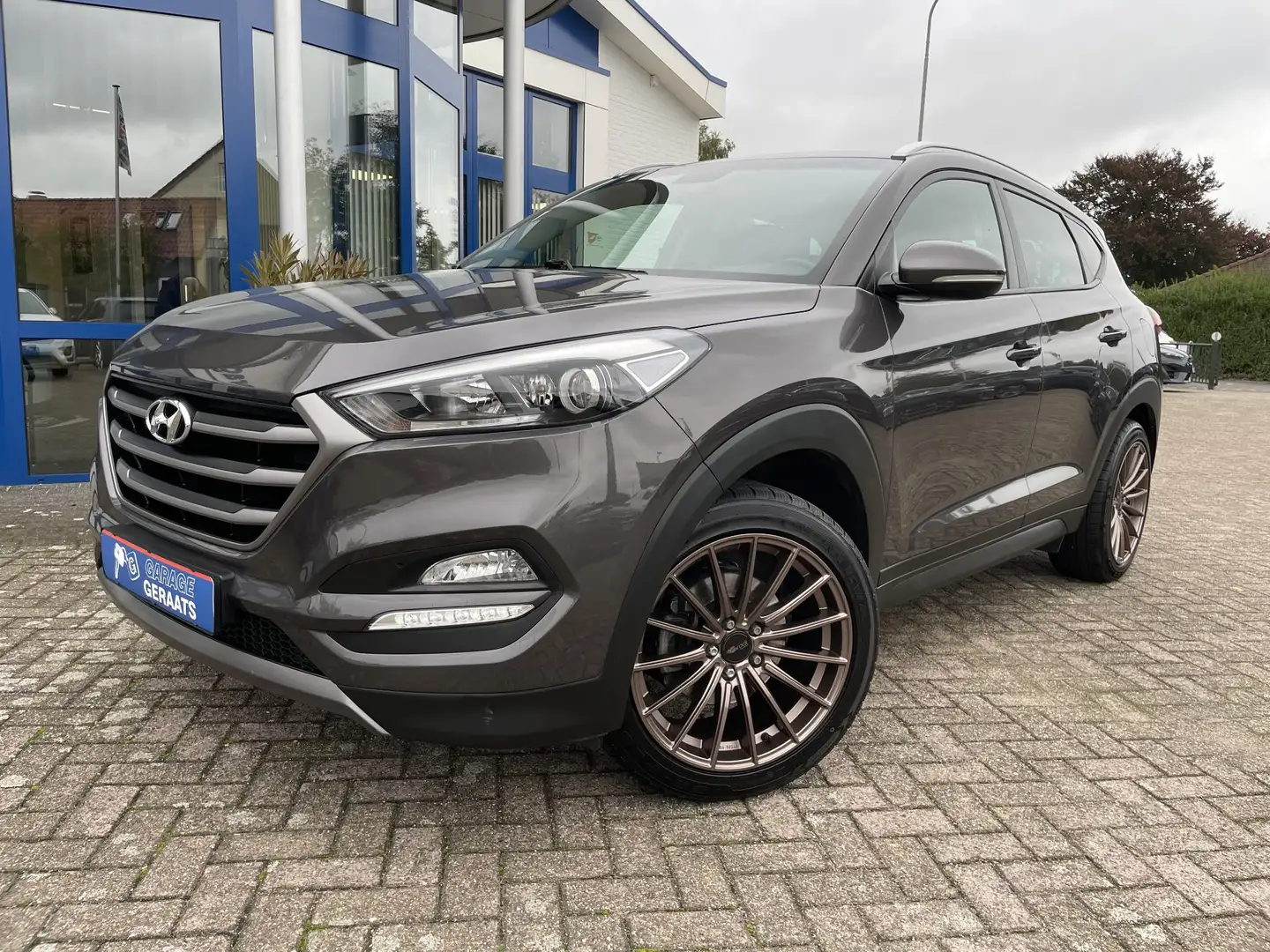 Hyundai TUCSON 1.6 GDi Premium | Dealer onderhouden, Navigatie, C Gris - 1