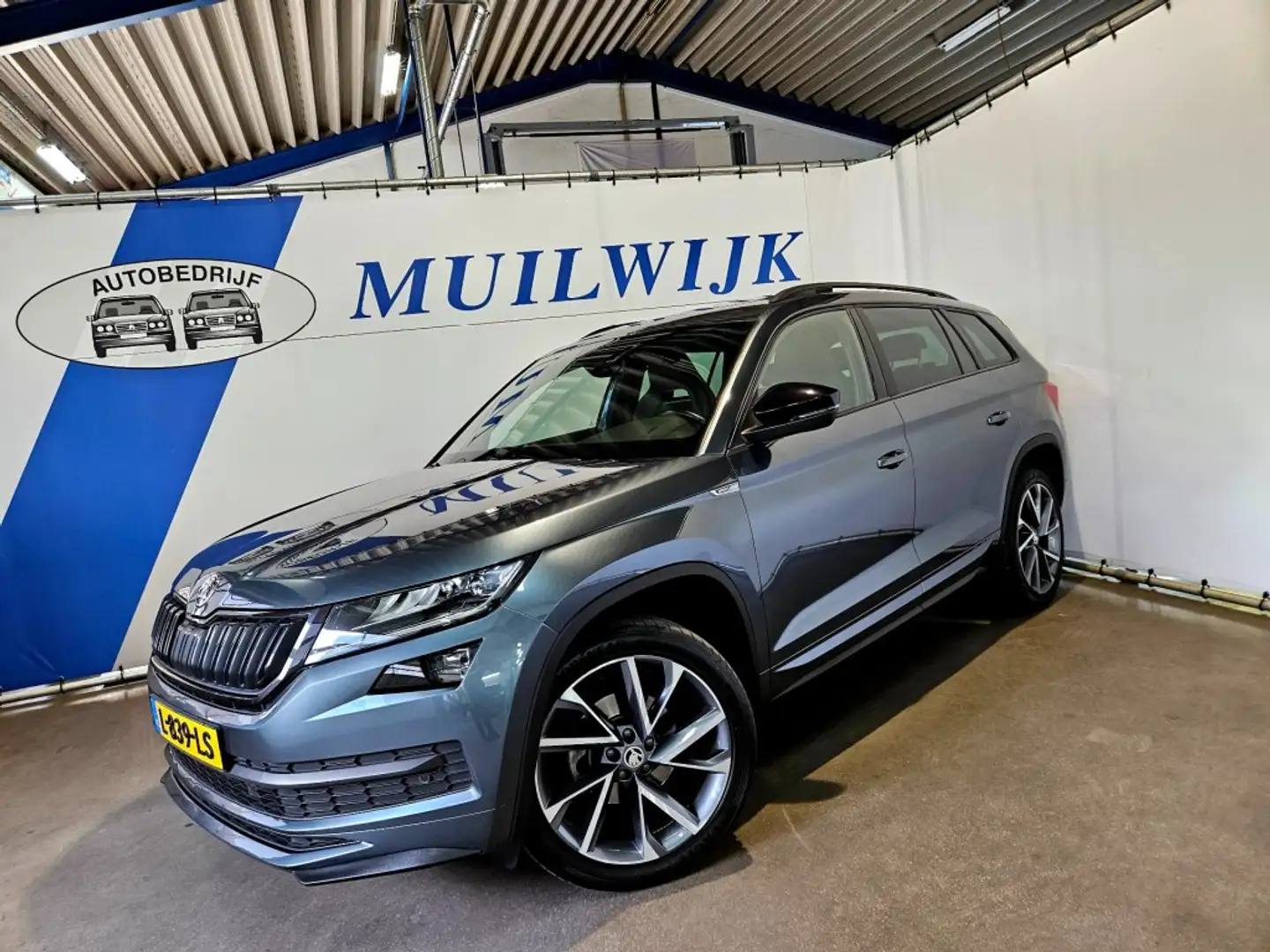 Skoda Kodiaq 1.5 TSI Sportline Business / Trekhaak / Pano / NL Grijs - 1