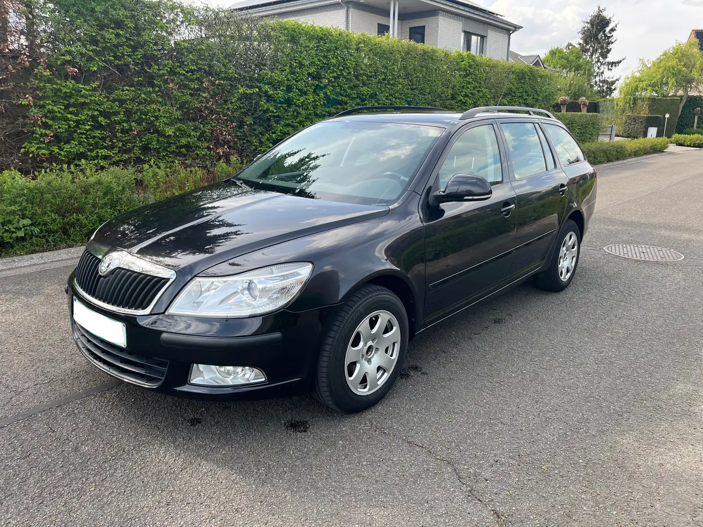 Skoda Octavia SW 1.6 TDi Elegance DSG Zwart - 1