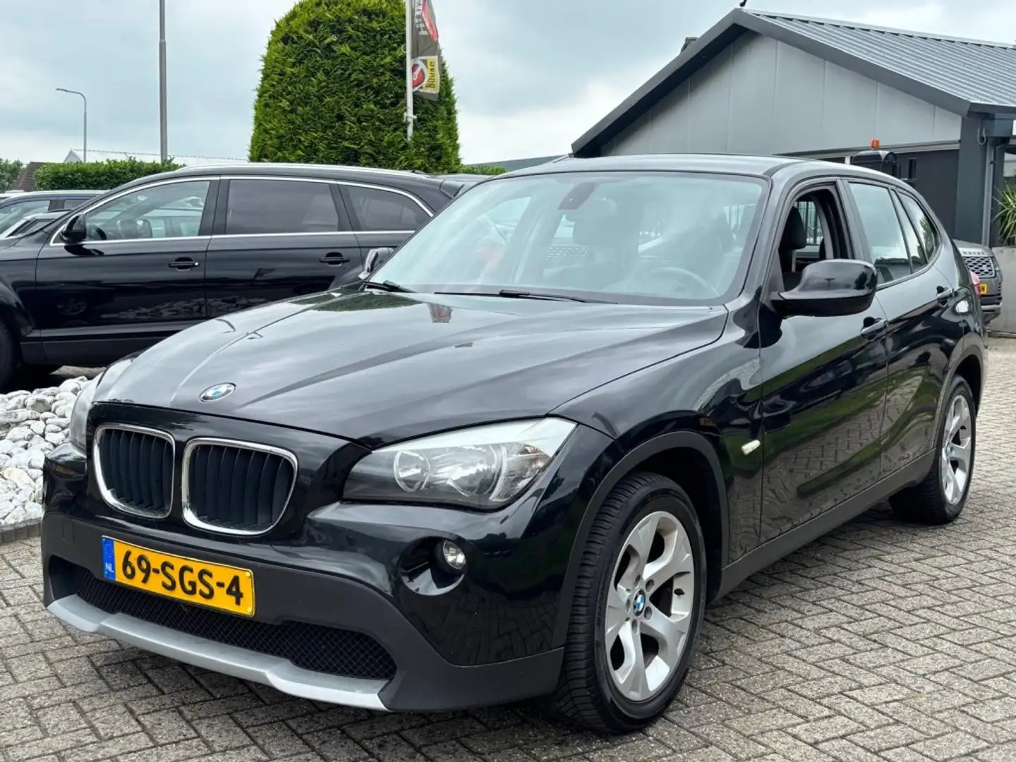 BMW X1 1.8D S-Drive Executive 2011 Zwart Trekhaak Zwart - 1
