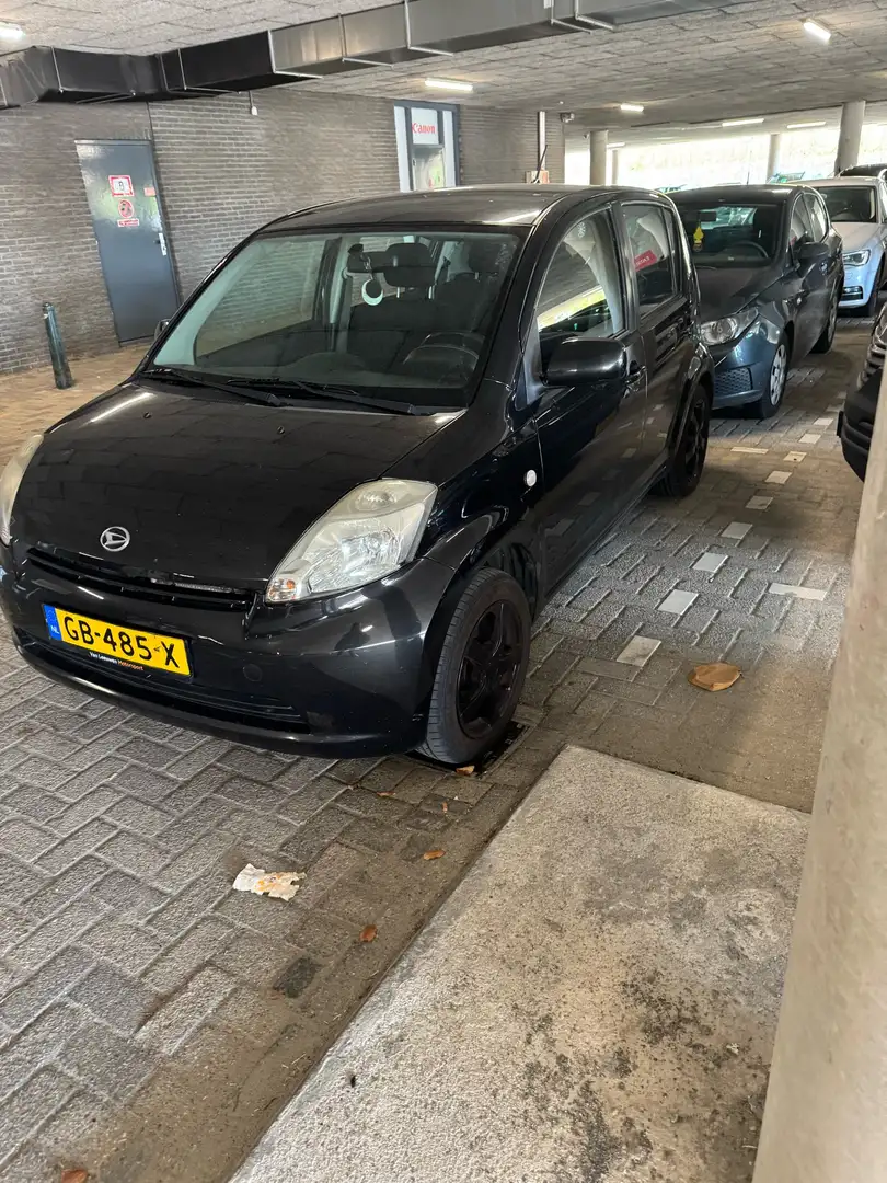 Daihatsu Sirion 1.0-12V Trend Zwart - 1
