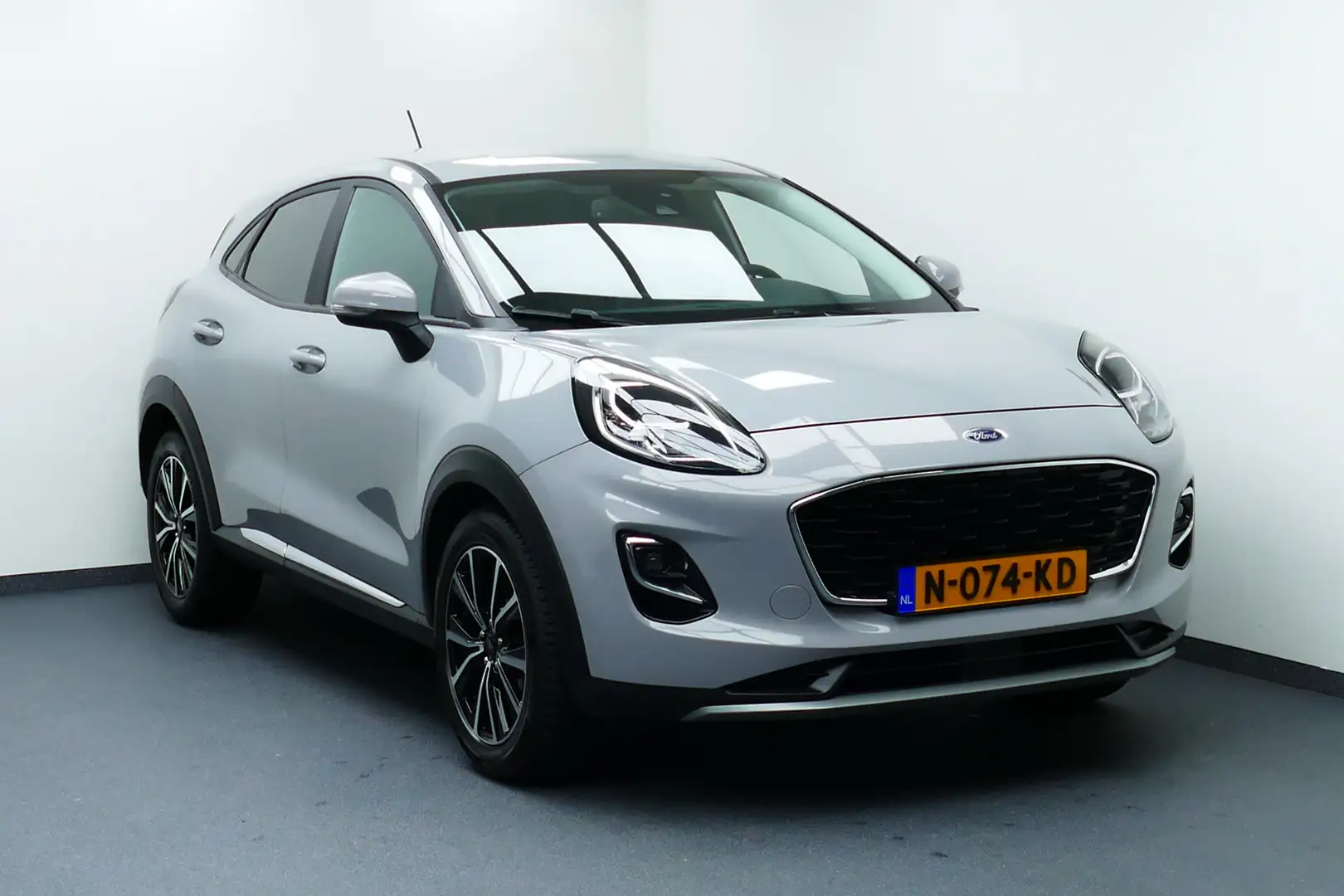 Ford Puma 1.0 125pk EcoBoost Hybrid Titanium X. Adaptief Cru Grijs - 1